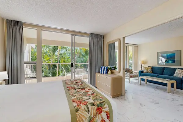 Peaceful bedroom with tropical views and natural light