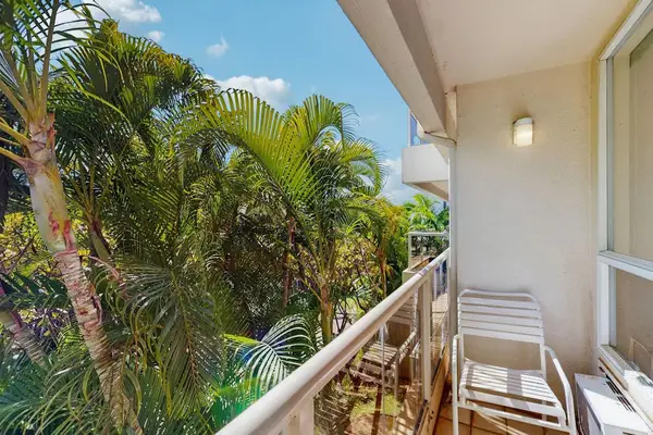 Step onto the balcony and enjoy lush tropical surroundings