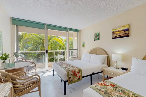 Cozy seating area with plenty of natural light and tropical views