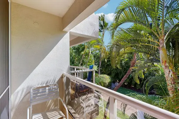 Enjoy fresh island air from the balcony surrounded by palms