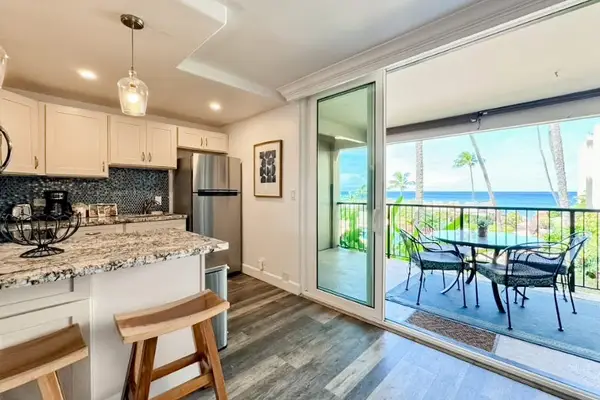 Kitchen and balcony area provide convenient dining with ocean views
