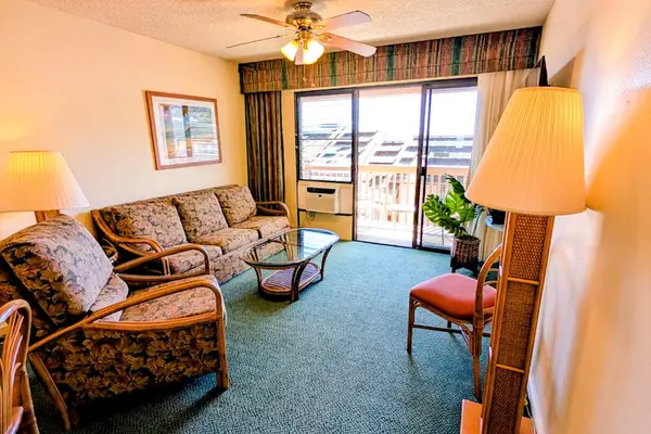 Comfortable living room with a private lanai and ocean views