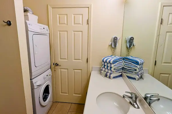 Convenient half bathroom with an in-unit washer and dryer