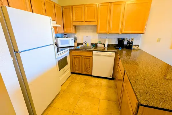 Spacious kitchen with ample counter space and modern appliances
