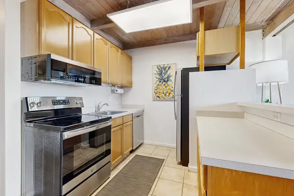 Fully stoked kitchen with stainless steel appliances.