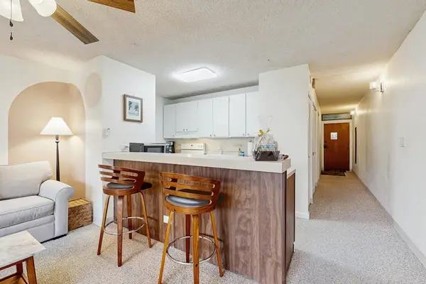 Kitchen Island & Breakfast Bar Seating with Entryway View