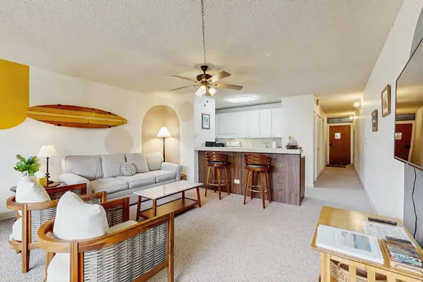 Open-Concept Living & Dining Area with Breakfast Bar & Smart TV