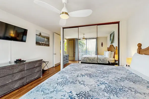 Bedroom with Mirrored Closet & Dresser