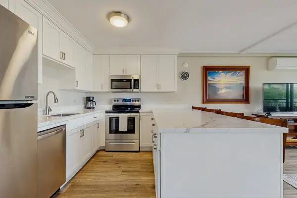 Open-concept layout connecting the kitchen seamlessly to the living area