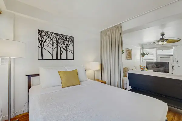 Unwind after a day of exploring in this inviting bedroom with a spacious queen-size bed.