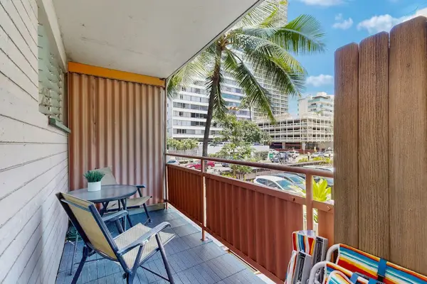 Enjoy a relaxing outdoor retreat with a cozy balcony setup featuring a coffee table, perfect for morning coffee or evening relaxation.