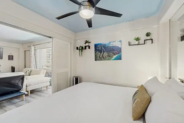Settle into a comfortable space with a king-size bed and ceiling fan, perfect for a relaxing stay.