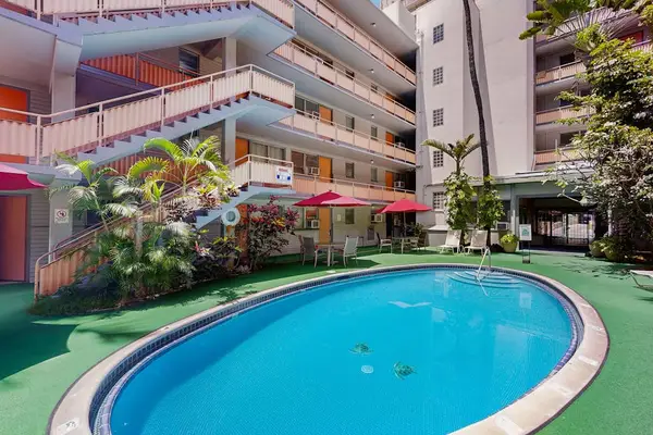 Cool off and enjoy vacation moments by the shared pool, a perfect spot to relax and recharge.