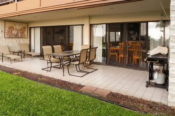 Covered patio offers outdoor dining comfortable seating and grill access