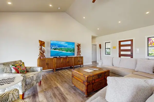 Modern Living Room with Large Smart TV & Tropical Decor