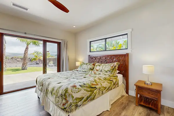 Bright Primary Bedroom with King Bed & Direct Lanai Access