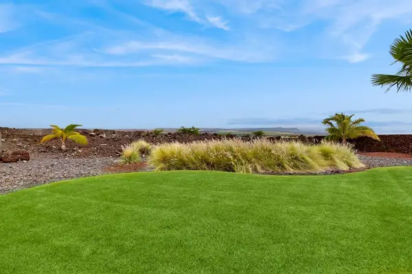 Manicured Lawn with Tropical Landscaping & Scenic Views