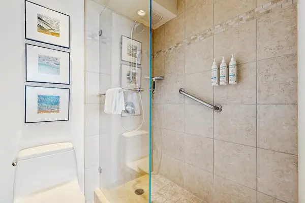 Clean Bathroom with a Spacious Shower.