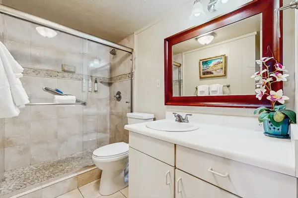 Master bathroom walk in tiled shower.