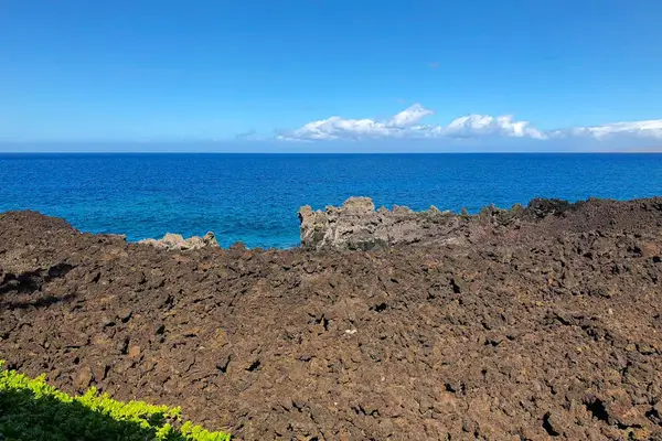 Striking Volcanic Formations Framing Pristine Coastline Waters