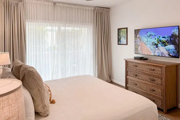 Spacious Primary Bedroom With TV