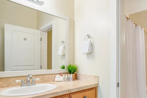 Bright Full Bathroom With Vanity