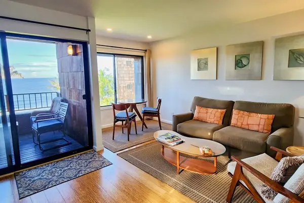 Bright living room opens toward ocean views with inviting seating