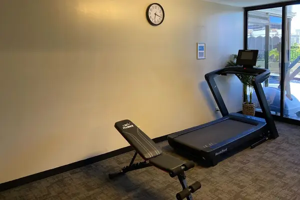 Stay active and energized with access to a shared fitness area equipped for your workout needs.