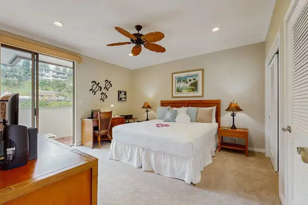 Master bedroom with king bed, flat screen tv and an ensuite bathroom.