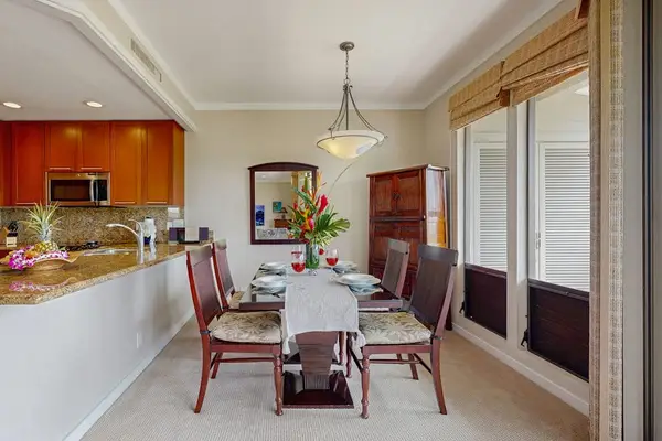 Dining room next to pictruesque windows so that you can enjoy a view while you eat.