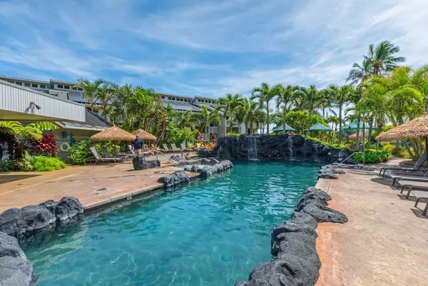 Resort pool with lounge chairs for sunny afternoons