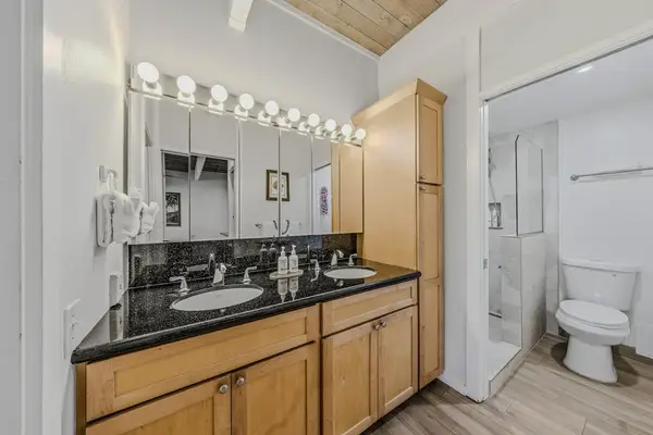 Bright Executive Bathroom With Double Vanity And Ample Storage