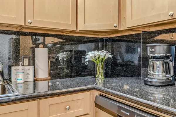 Sleek Granite Countertops And Complimentary Coffee Setup