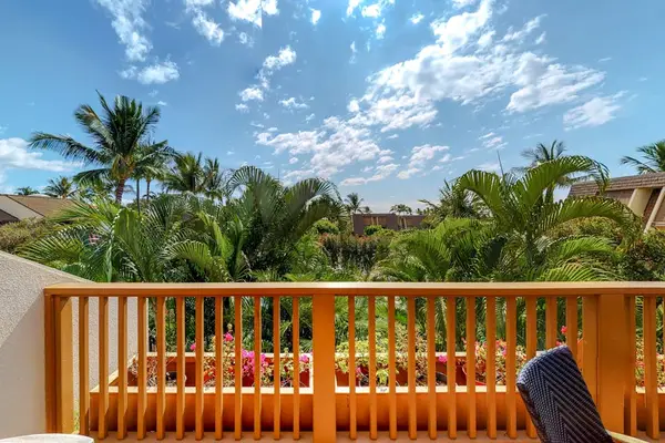 Sunlit Private Balcony Overlooking Tropical Palms