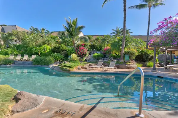 Pool Steps with View of Waterfall and Tropical Gardens