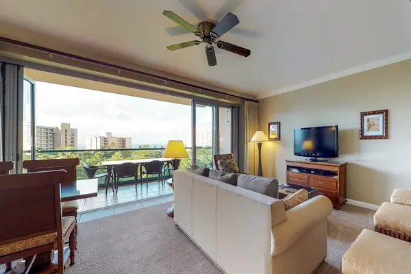 Spacious living and dining room with carpeted flooring and beautiful views, ideal for resting and unwinding with your family.