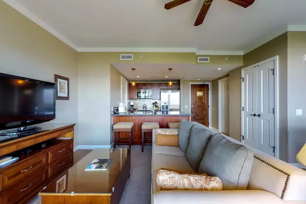 Cozy living area featuring a large TV for movie nights and a comfortable sleeper sofa for taking a quick nap.