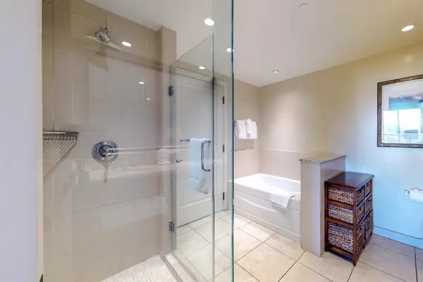 Refresh, relax, and recharge in our comfortable bathroom featuring a modern walk-in shower.