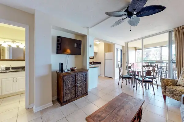 Living space with a dark wood cabinet.