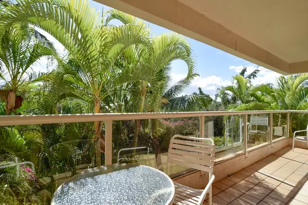 Cozy lanai overlooking lush island greenery