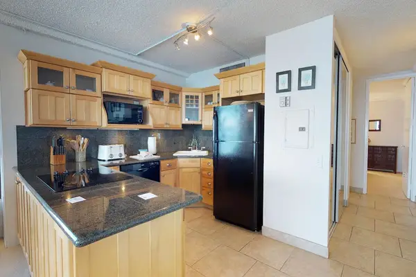 Fully stocked kitchen open to the rest of the unit with this open concept feel, lots of natural light.