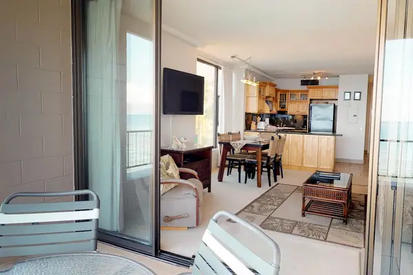 Living room with sliders to the lanai for great views of the Pacific Ocean.