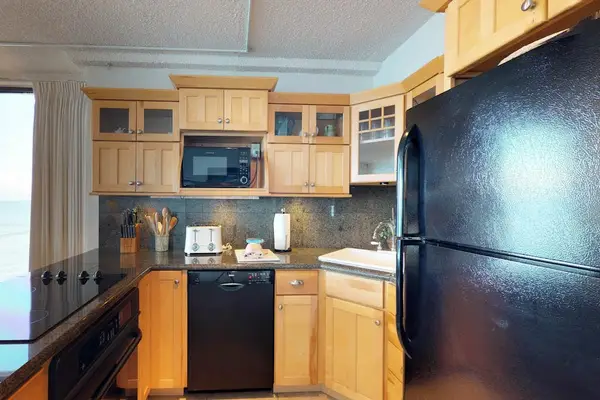 Fully stocked kitchen open to the rest of the unit with this open concept feel, lots of natural light.