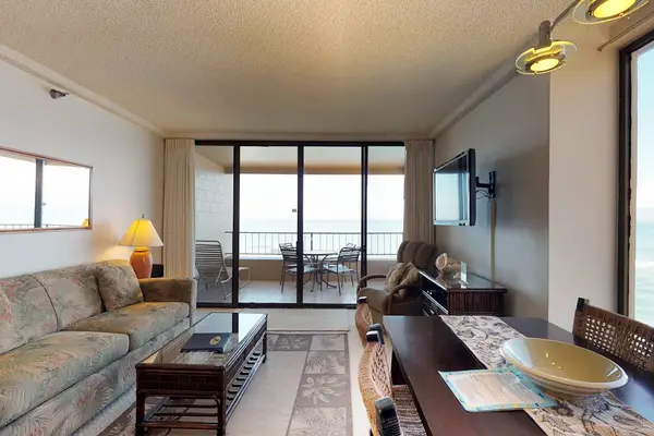 Living room with a sofa bed for extra company and a flat screen tv.