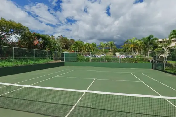 Tennis court surrounded by scenic mountain views