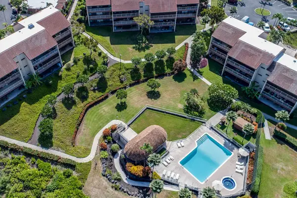 Bird's-Eye View of the Sparkling Resort Pool, Hot Tub, and Pavilion Area