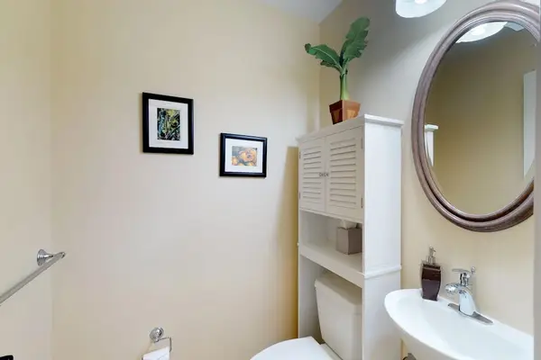 Guest Powder Room with Pedestal Sink & Storage Cabinet