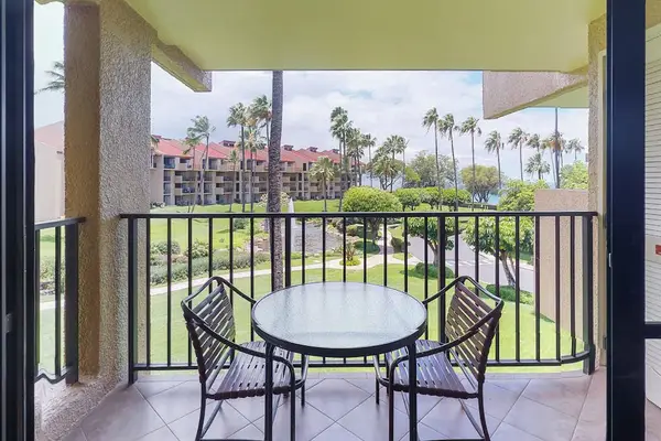 Enjoy tropical resort views from the furnished lanai