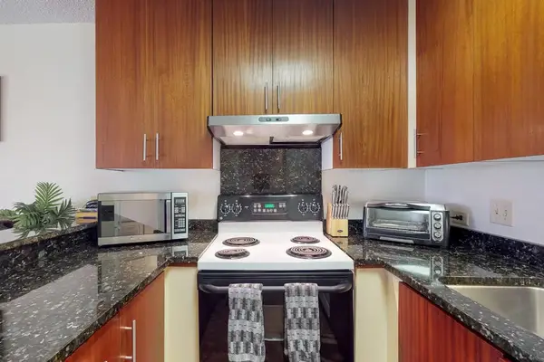 Well-appointed kitchen with ample cabinetry and counter space