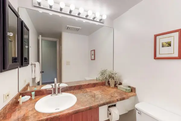 Spacious bathroom counter with a large mirror